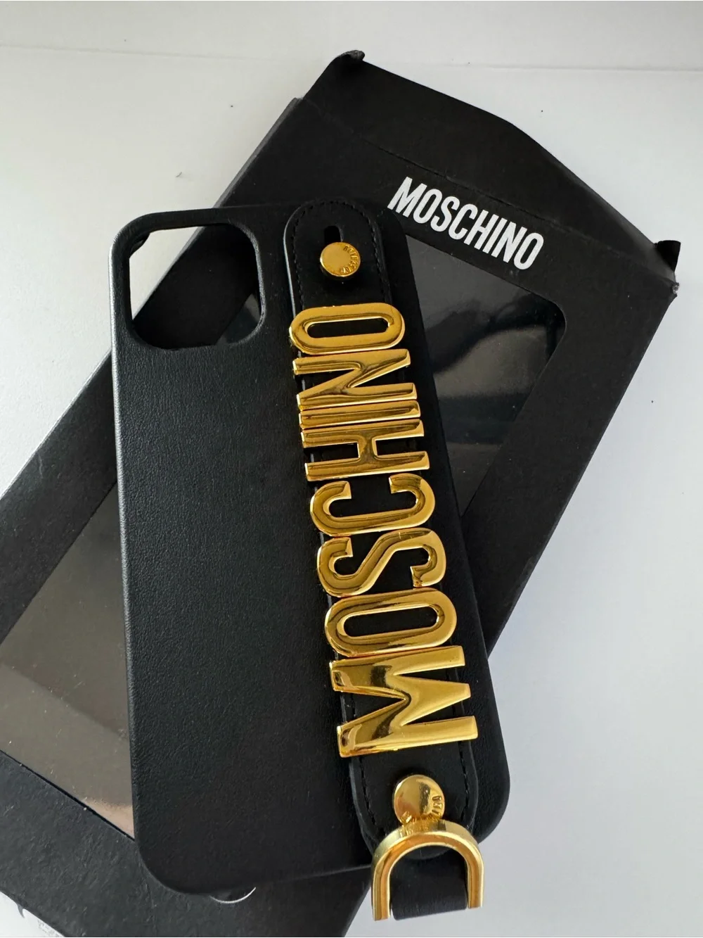 Moschino black letters gold